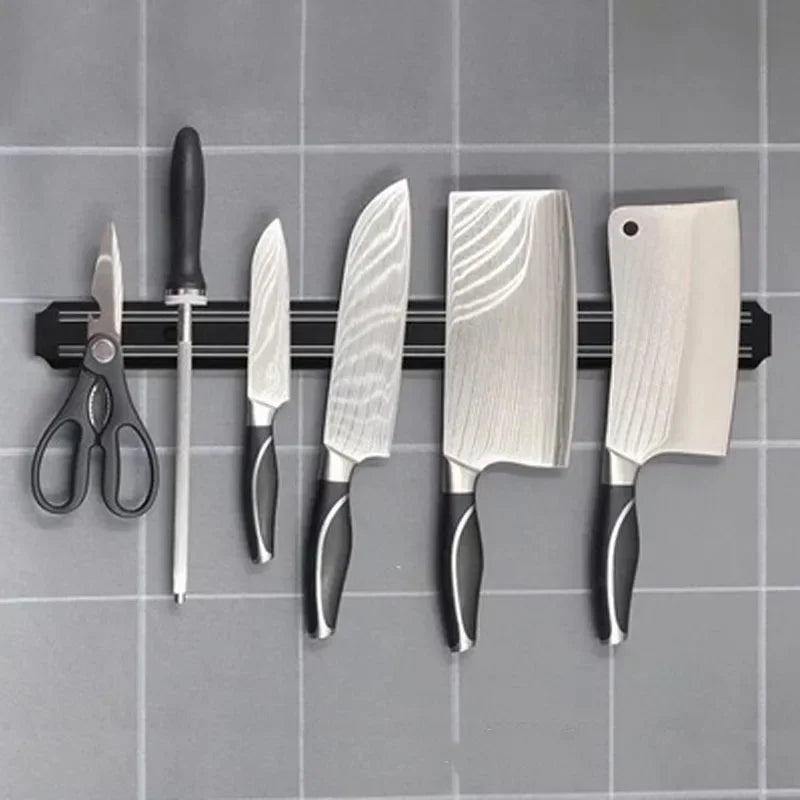 Magnetic knife strip holding knives