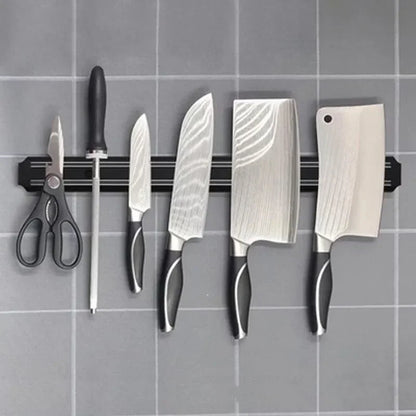 Magnetic knife strip holding knives
