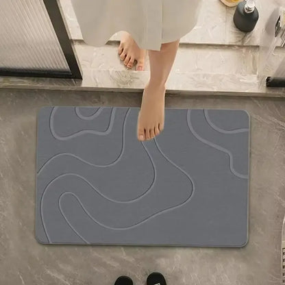 Stone bath mat in bathroom